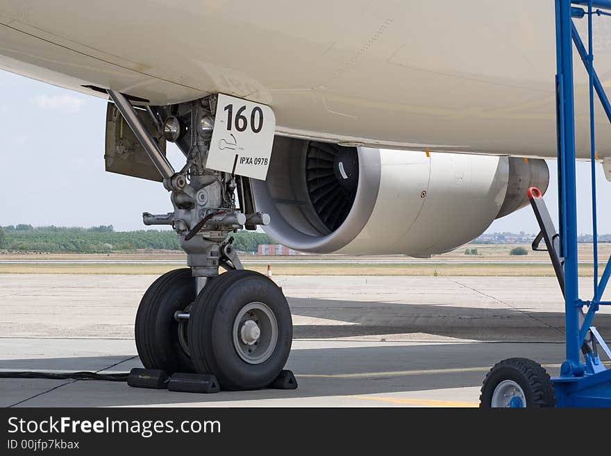 Modern airplane standing on the airport, underside view. Modern airplane standing on the airport, underside view