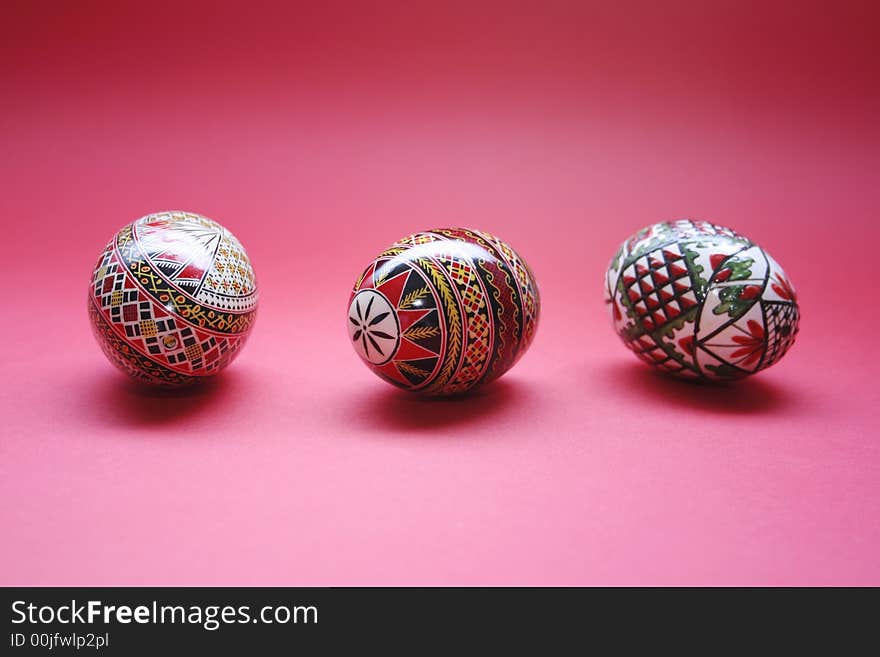 Three easter eggs isolated on red