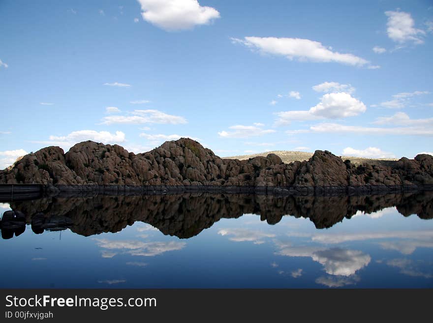 A perfectly still afternoon on Watson Lake reflects everything. Note the gray lines on the surrounding granite, the former water level. Prescott is experiencing a drought. A perfectly still afternoon on Watson Lake reflects everything. Note the gray lines on the surrounding granite, the former water level. Prescott is experiencing a drought.