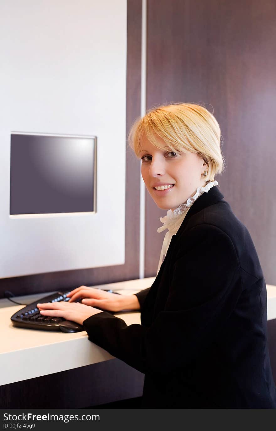 Young businesswoman working on the computer. Young businesswoman working on the computer