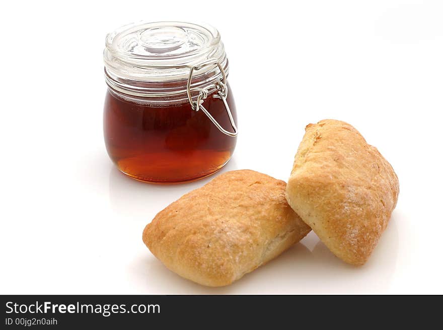 Honey and Bread rolls isolated on white