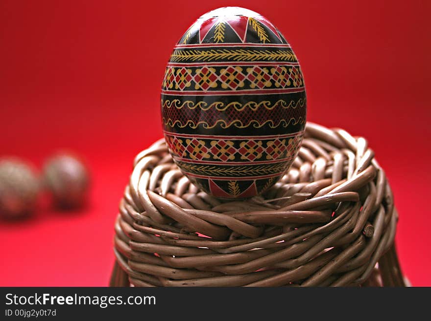 One easter egg isolated on red