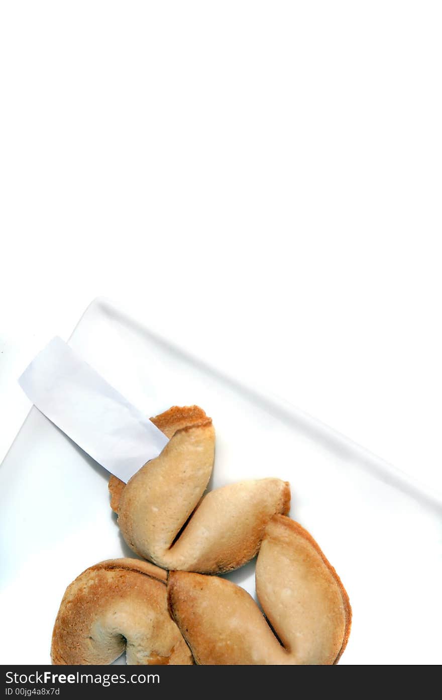 Fortune cookies on a white plate and white background. Fortune cookies on a white plate and white background.