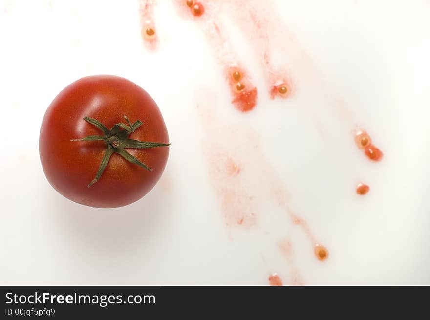 Single tomato on squeezed tomato. Single tomato on squeezed tomato