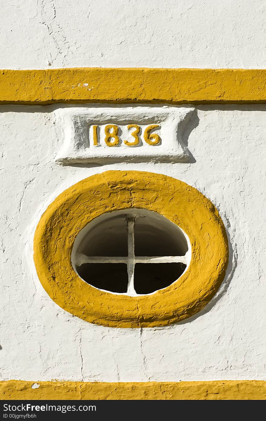 Round window with date in a frame