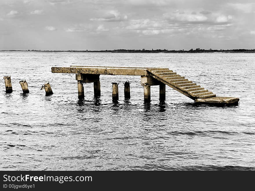 Part of the destroyed pier in water