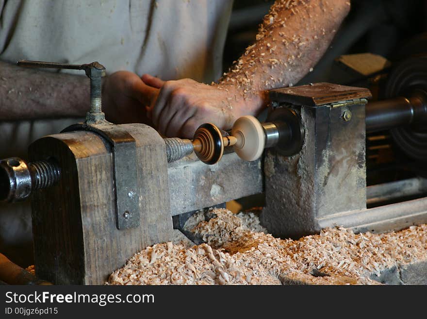 Cabientmaker makes a spinning top. Cabientmaker makes a spinning top