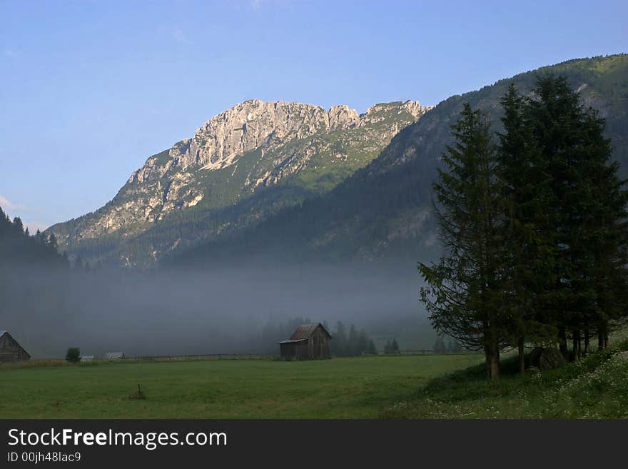 Big mountain in clouds and sunshines.