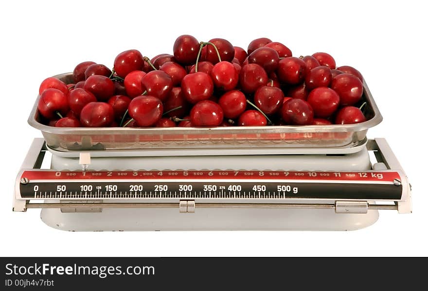 The cherry and scales, isolated on white with clipping path. The cherry and scales, isolated on white with clipping path.