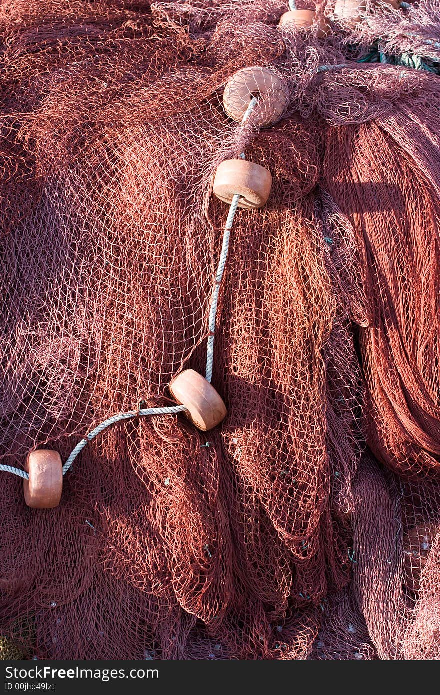 Fishing nets piled up showing colour and texture