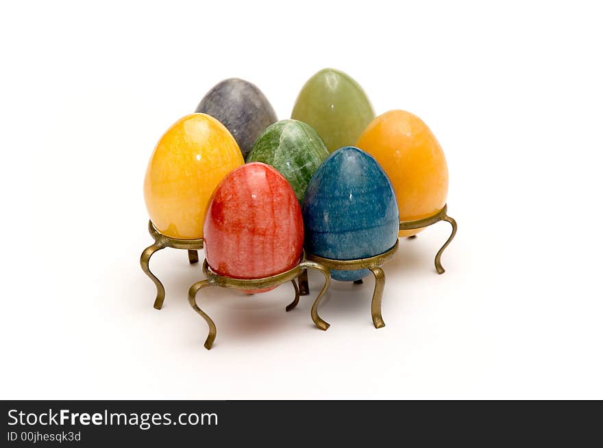 Some beautiful colored eggs over white background. Some beautiful colored eggs over white background