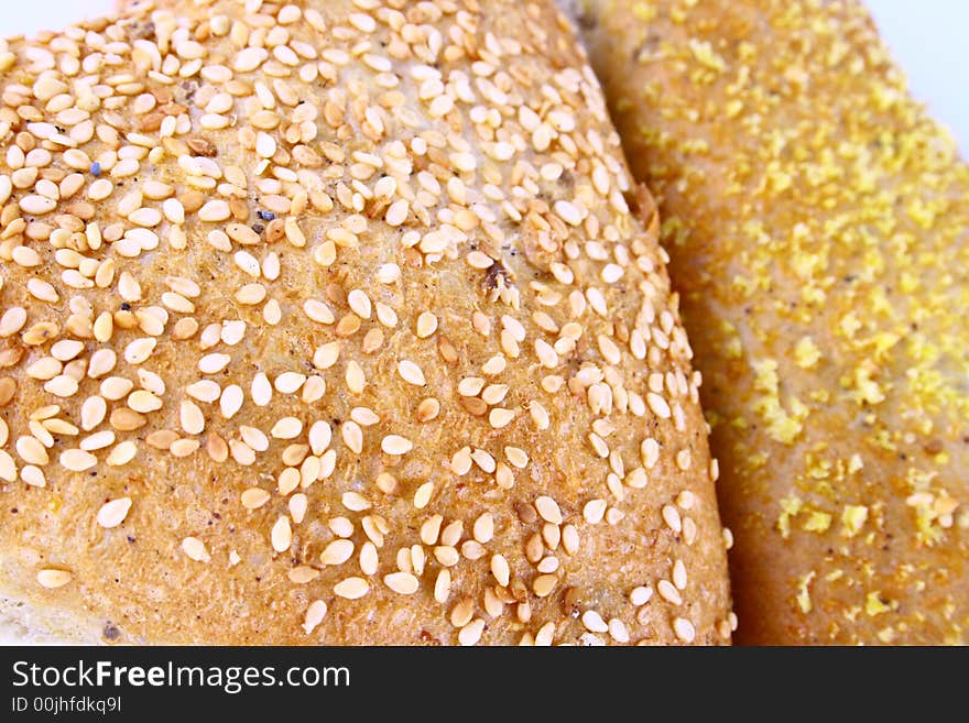 Different bread arranged on table close up. Different bread arranged on table close up