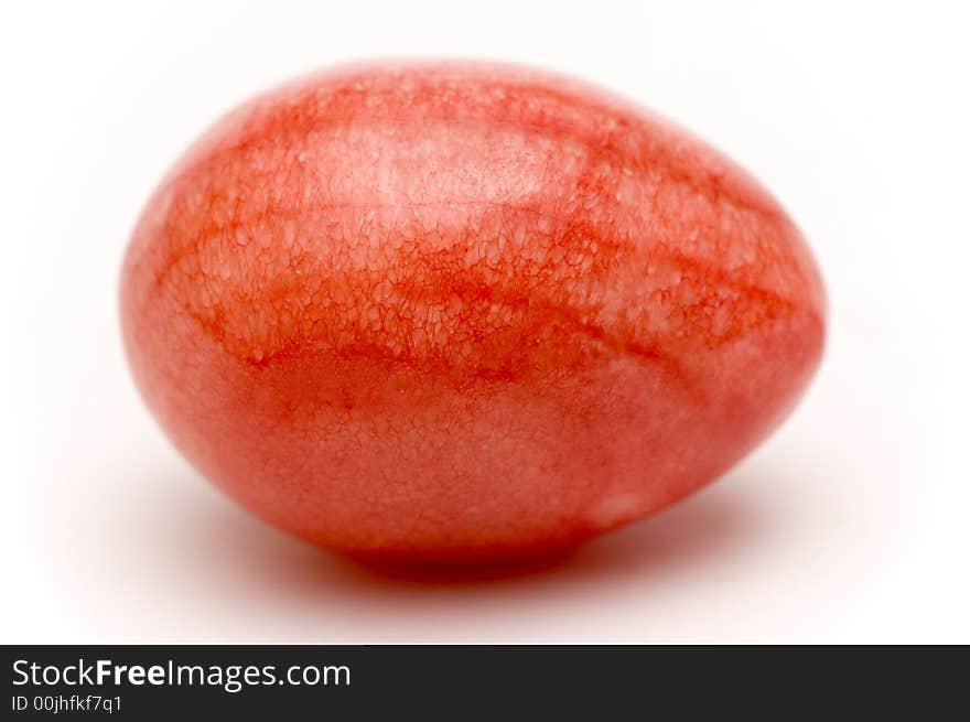 A red egg over white background. A red egg over white background