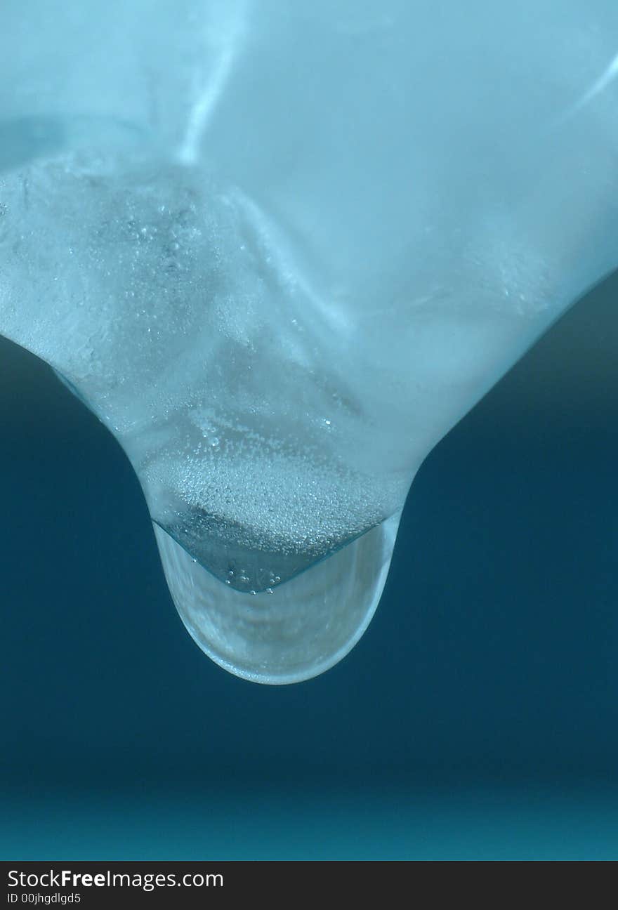 Drop of water, a few seconds before falling off from the icicle. Drop of water, a few seconds before falling off from the icicle.