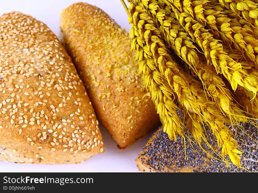 Different bread arranged on table close up. Different bread arranged on table close up