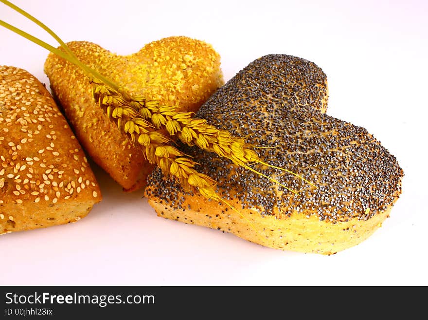 Different bread arranged on table close up. Different bread arranged on table close up