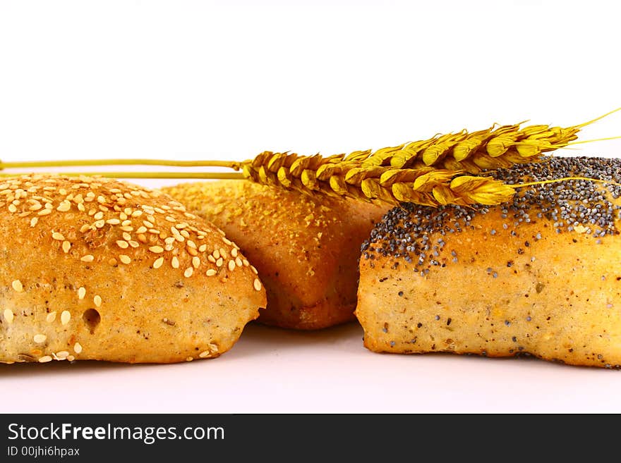 Different bread arranged on table close up. Different bread arranged on table close up