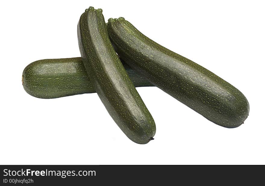 Three fresh french mini marrows courgettes isolated on white background