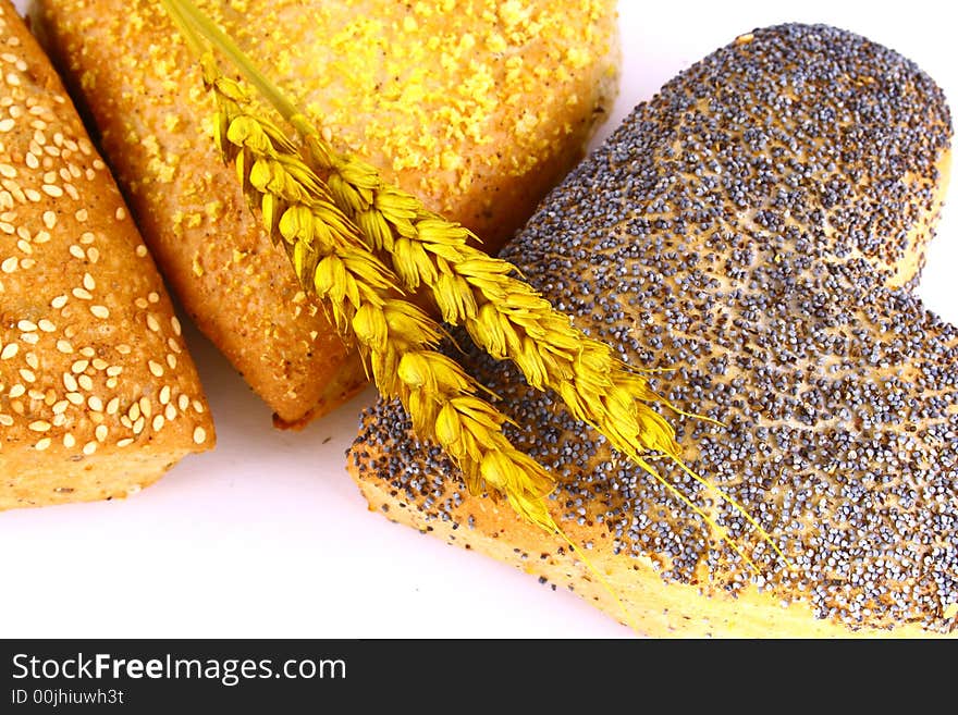 Different bread arranged on table close up. Different bread arranged on table close up