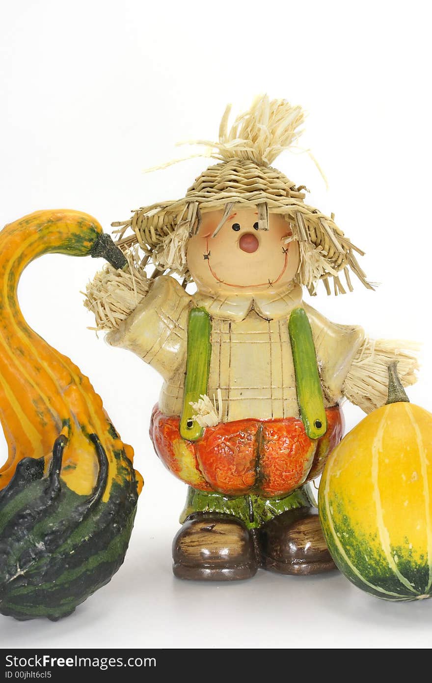 Scarecrow Halloween decoration with two pumpkins on white background