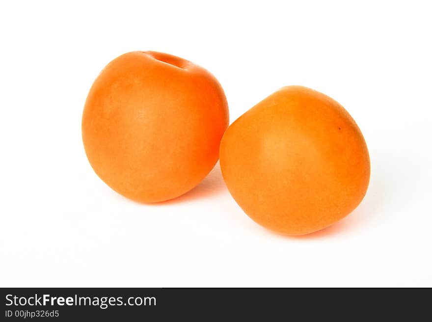 Apricots on white background