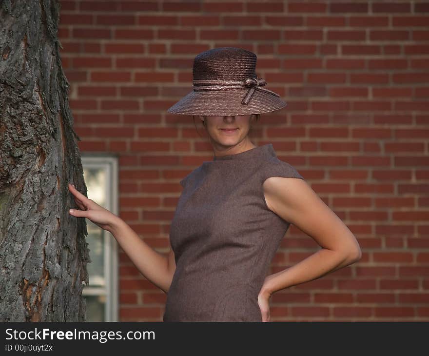 Woman Posing by the Tree