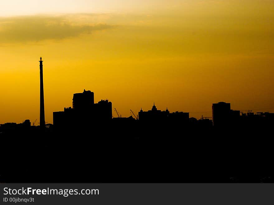 A yellow and black picture of a city