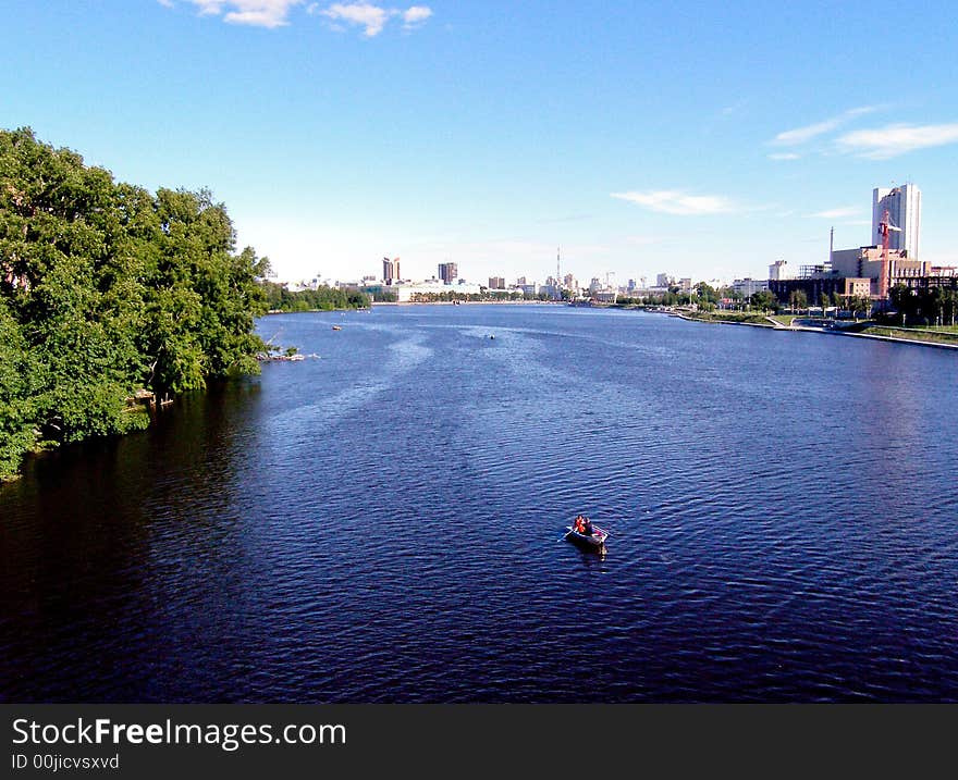 Deep blue river and a couple in the boat