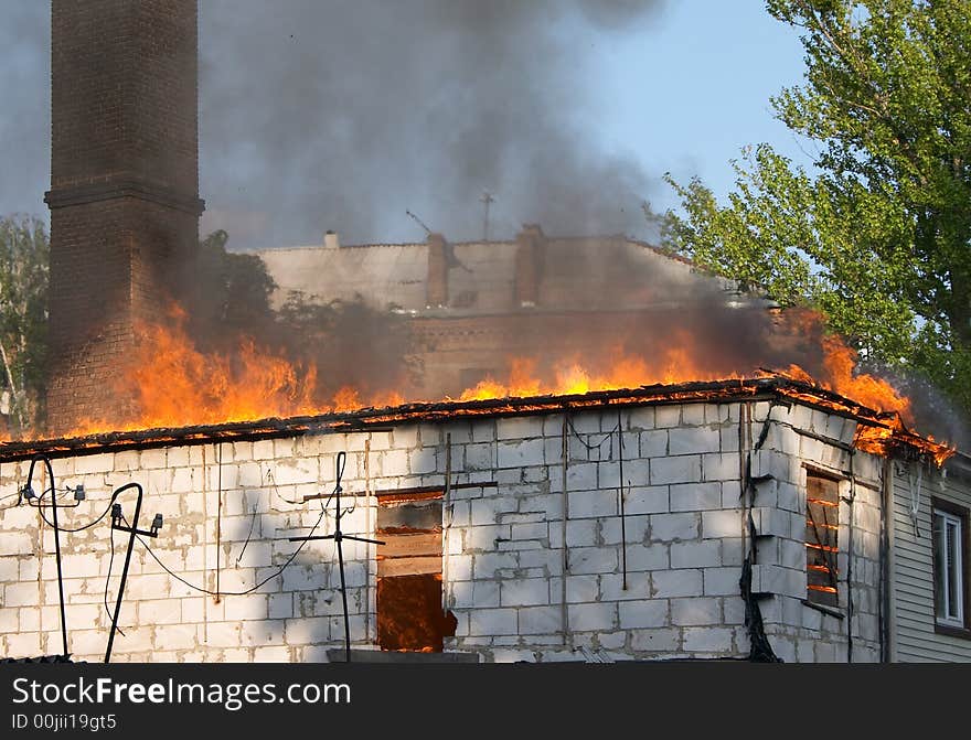 Small house flaming in fire. Small house flaming in fire