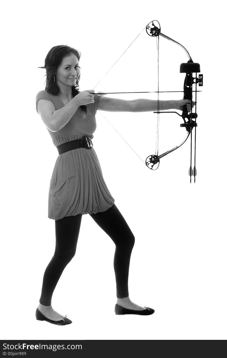 Pretty girl in red top pulling back compound bow. Pretty girl in red top pulling back compound bow