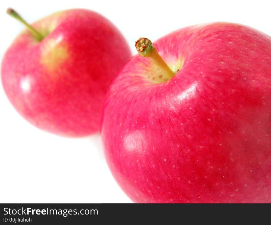 Two red apples isolated on white