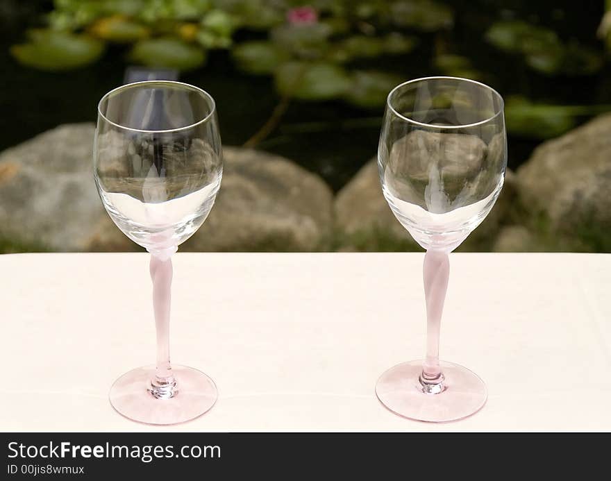 Pair of Wine Glasses on a White Table Cloth