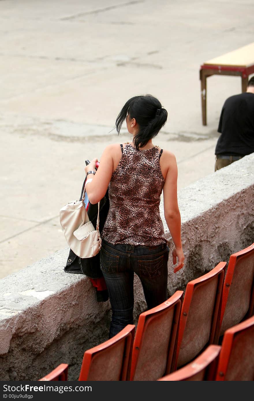 A nice girl alone in the stadium