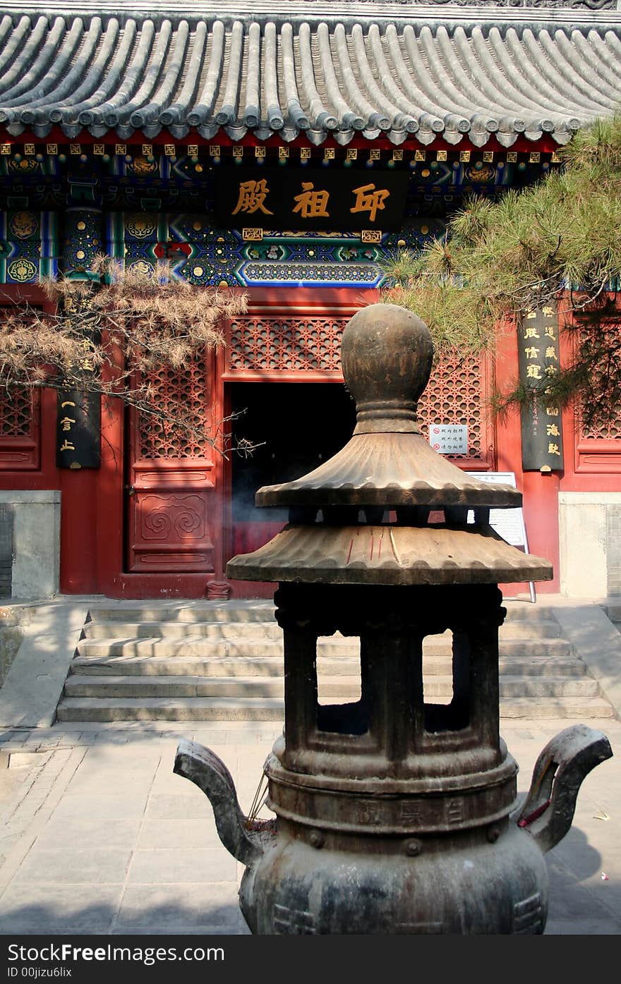 Incense burning in front of a temple in Beijing, China. Incense burning in front of a temple in Beijing, China