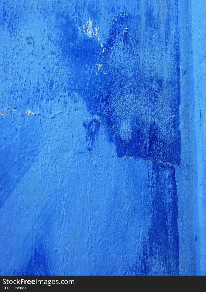 Old blue wall with dark bruises