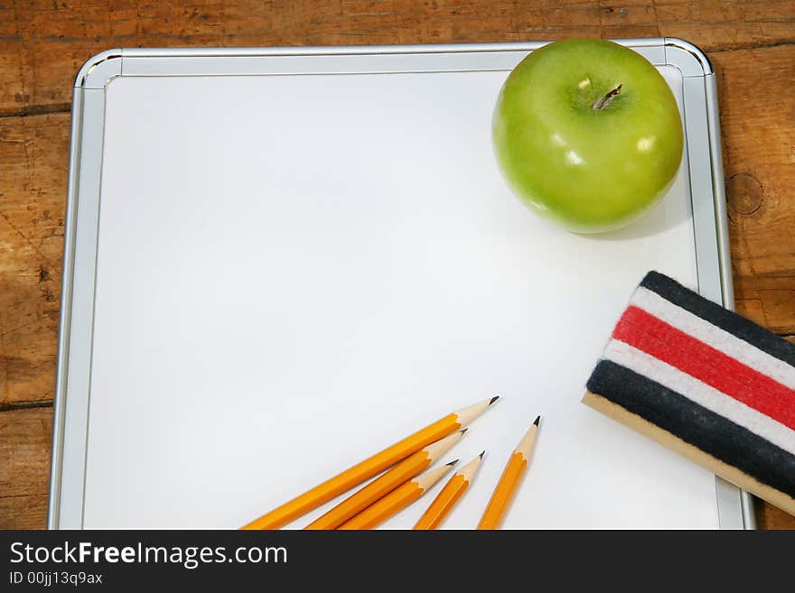 Small memo board for school with green apple