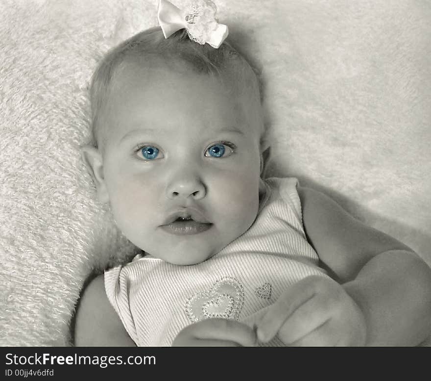 Portrait of a baby girl ... selective coloring on the blue eyes.