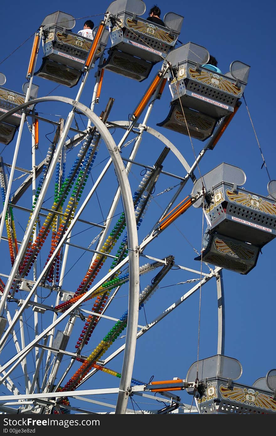 Ferris wheel with people on it at the local fair