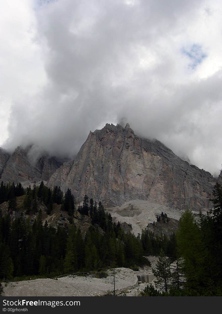 A view of Dolomitic mountains in Italy with clouds