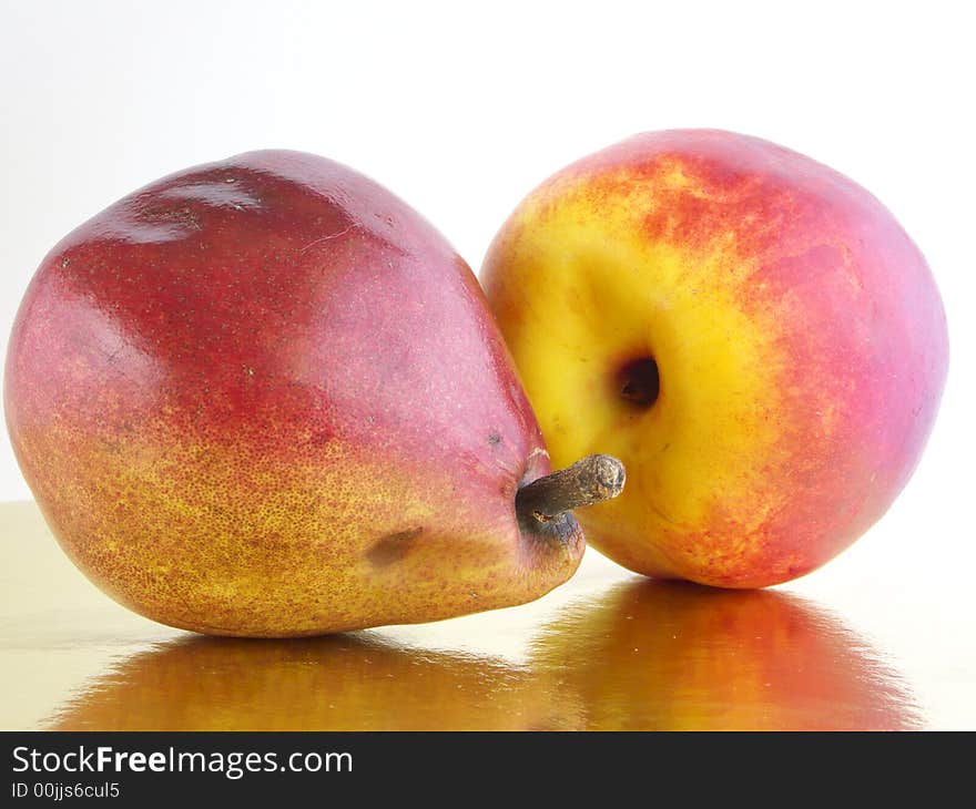 Peach and pear with pickaxe reflected in gold. Peach and pear with pickaxe reflected in gold.