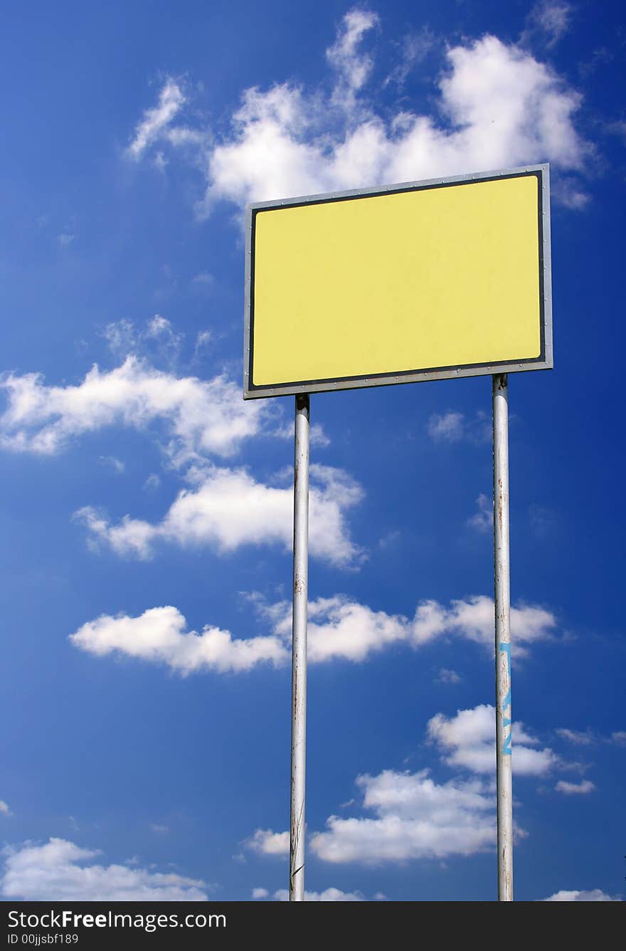 Blank sign with space for you text against deep blue sky. Blank sign with space for you text against deep blue sky