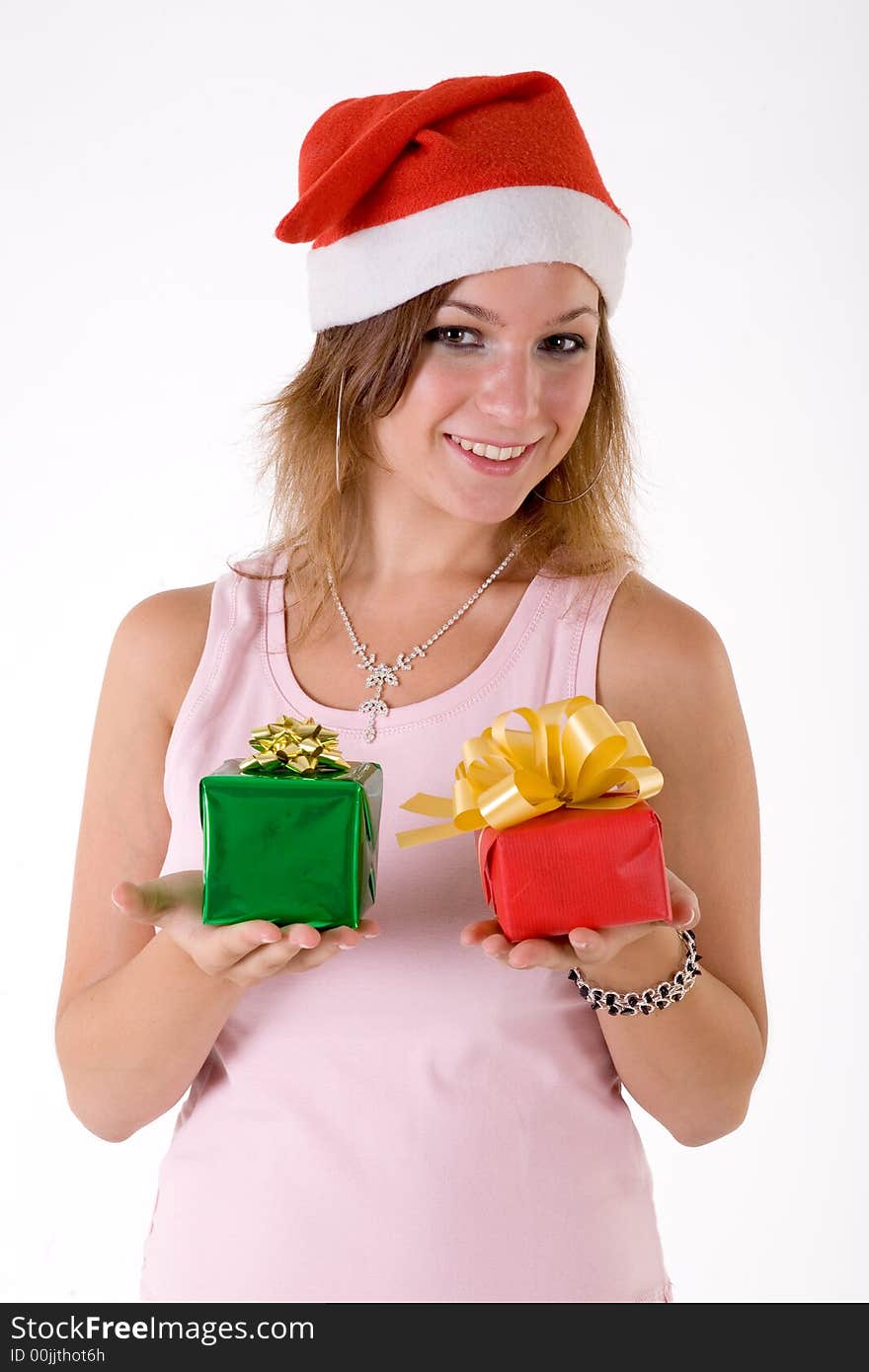 Girl wearing a santa hat and holding a gift box. Girl wearing a santa hat and holding a gift box