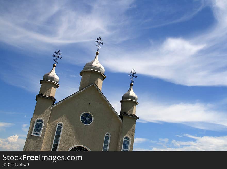 Skewed perspective of church against blue sky. Skewed perspective of church against blue sky.