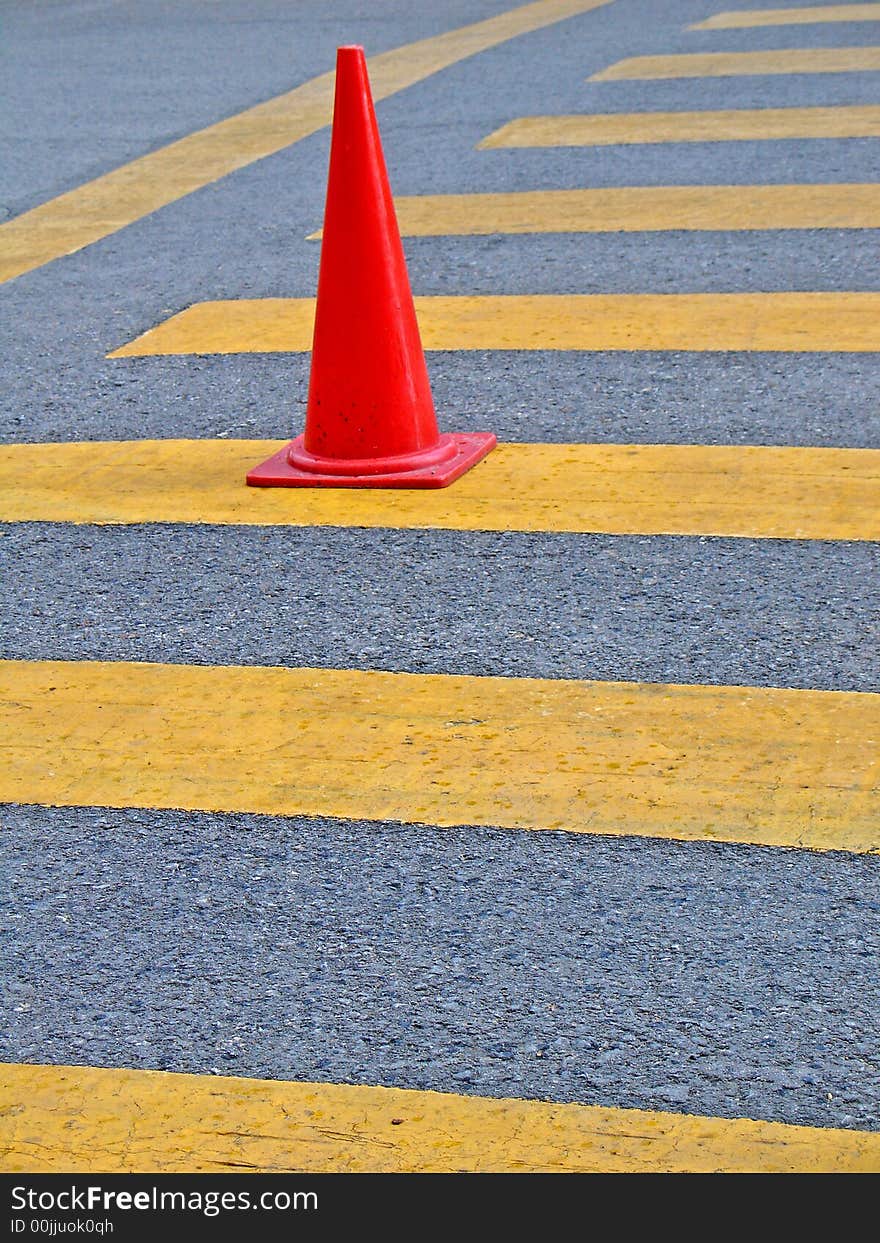 Red traffic Cone on the road.