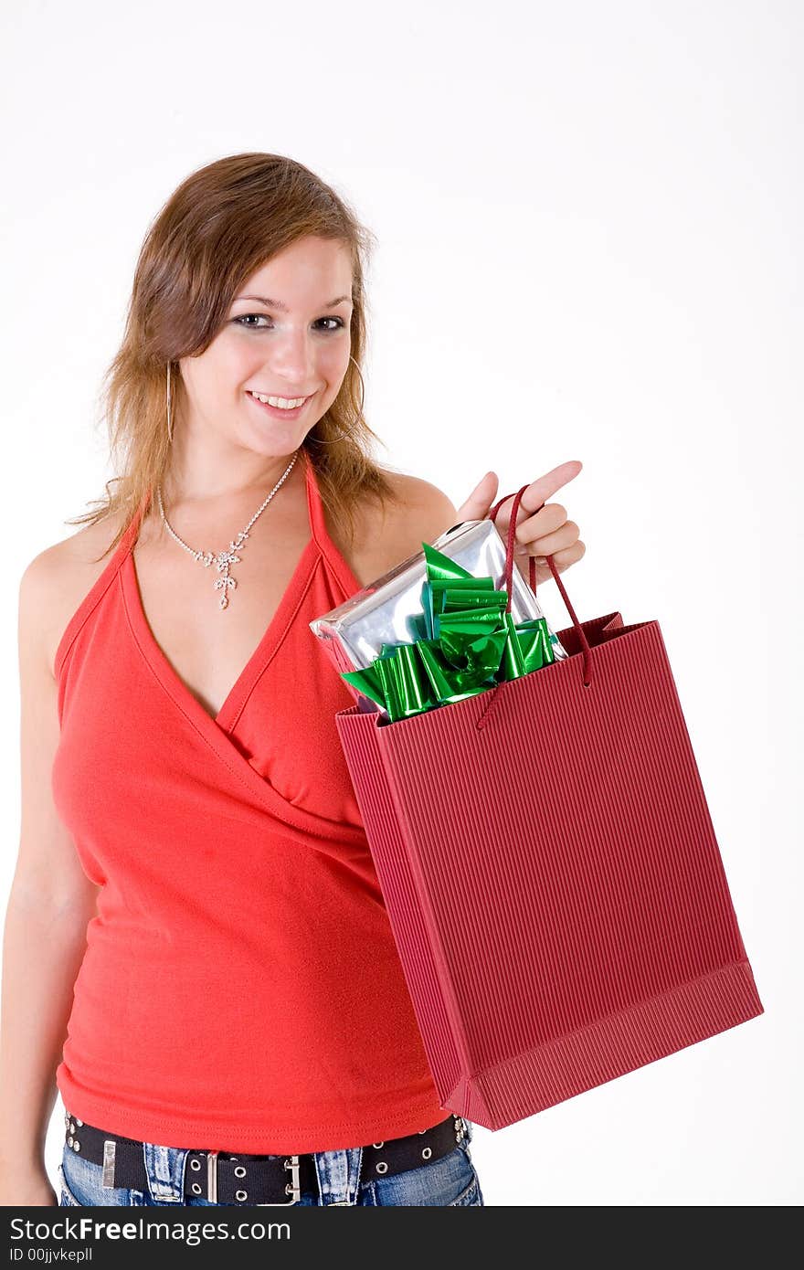 Girl wearing a santa hat and holding a gift box. Girl wearing a santa hat and holding a gift box