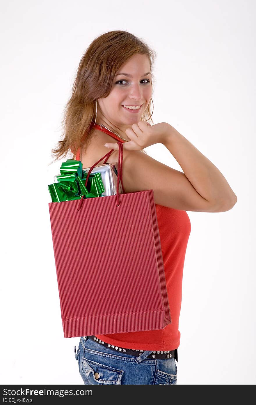 Girl wearing a santa hat and holding a gift box. Girl wearing a santa hat and holding a gift box