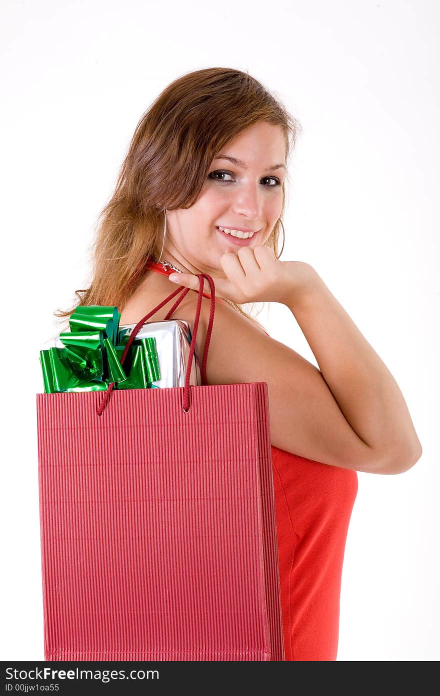 Girl wearing a santa hat and holding a gift box. Girl wearing a santa hat and holding a gift box