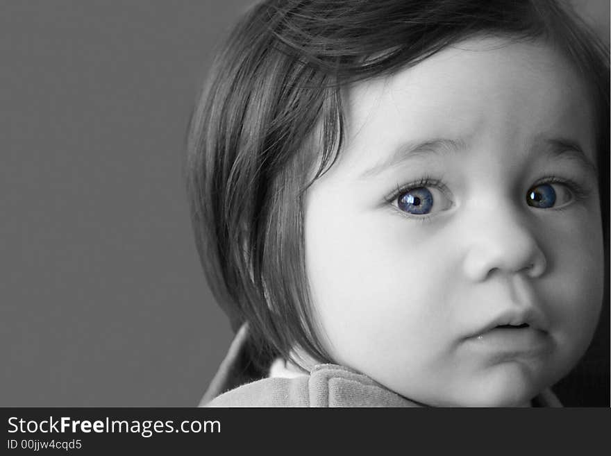 Black and White portrait of a young girl with digitally enhanced blue eyes. Black and White portrait of a young girl with digitally enhanced blue eyes.