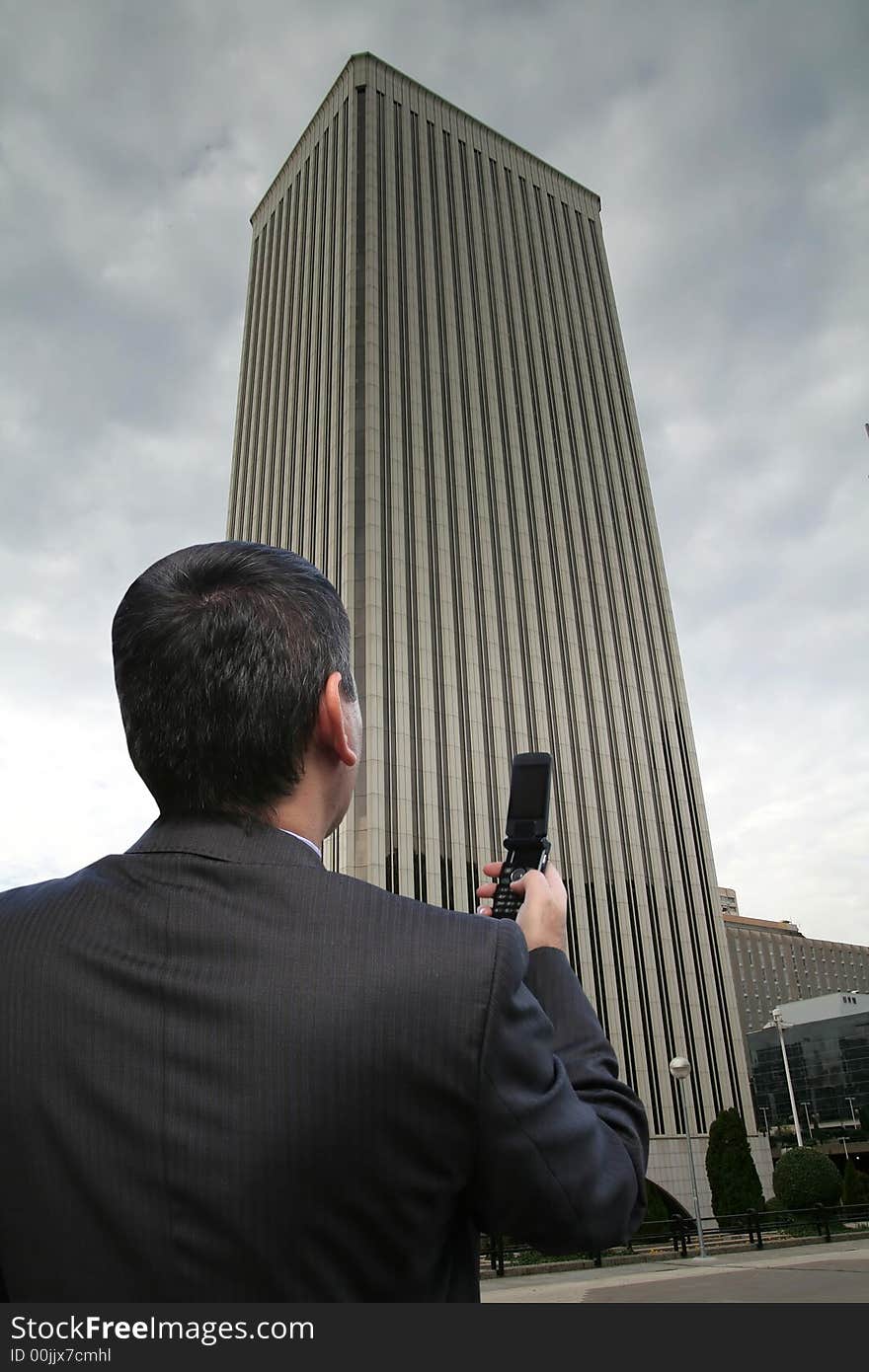 Businessman on a call in the busy businesspark