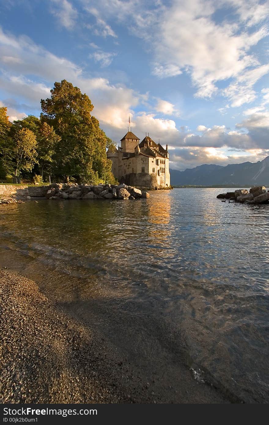 A medieval fortress ?hillon on lake Leman on a sunset. A medieval fortress ?hillon on lake Leman on a sunset